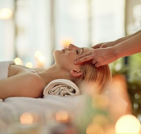 Cropped shot of a young woman enjoying a head massage at a spa